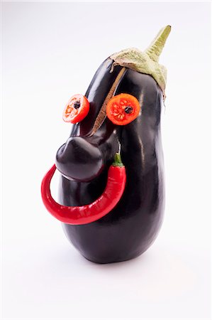 still life chili - A face made from an aubergine, tomatoes and chilli peppers Stock Photo - Premium Royalty-Free, Code: 659-07738778