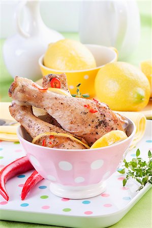 simsearch:622-07841038,k - Baked chicken legs with lemon and chilli peppers Stock Photo - Premium Royalty-Free, Code: 659-07738772