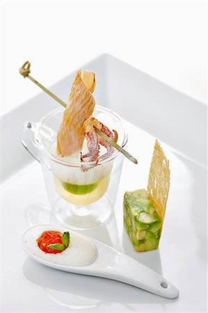 Avocado soup with an octopus skewer and asparagus terrine Stock Photo - Premium Royalty-Free, Code: 659-07738810