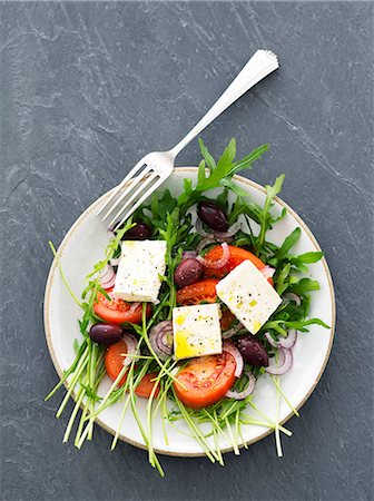 salad isolated - Rocket salad with tomatoes, feta and kalamata olives Stock Photo - Premium Royalty-Free, Code: 659-07738836