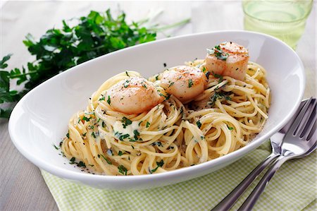 shellfish dishes - Spaghetti with a creamy cheese sauce and scallops Stock Photo - Premium Royalty-Free, Code: 659-07738878