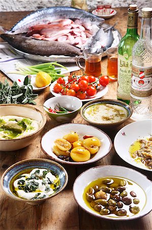 fruits on wooden table - Mazet - Middle Eastern breakfast featuring olives, salted lemons, hummus, tahini, aubergine, red mullet and arak Stock Photo - Premium Royalty-Free, Code: 659-07739033