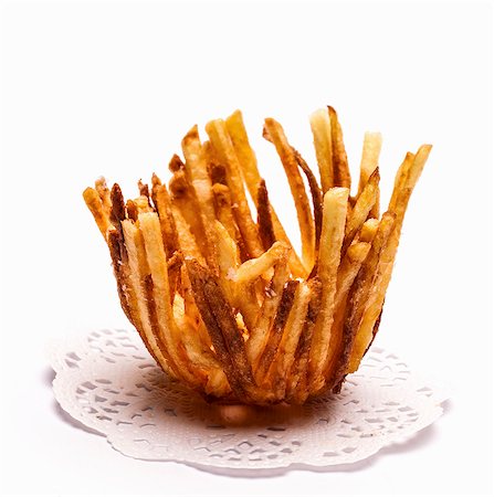 fries white background - Chips on a doily Stock Photo - Premium Royalty-Free, Code: 659-07739104