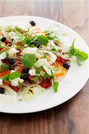 Mixed leaf salad with oranges, fennel, onions and olives Stock Photo - Premium Royalty-Free, Code: 659-07739259