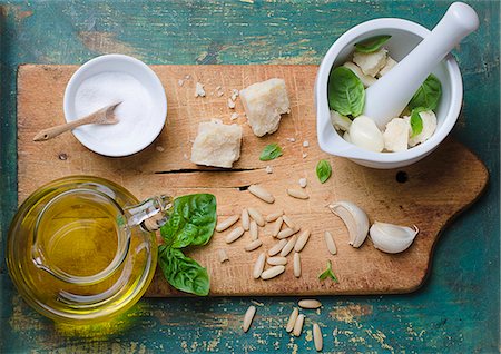 pestle - Ingredients for basil pesto on a chopping board Stock Photo - Premium Royalty-Free, Code: 659-07739298