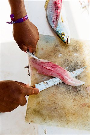 Ceviche being made: fish being filleted Fotografie stock - Premium Royalty-Free, Codice: 659-07739464