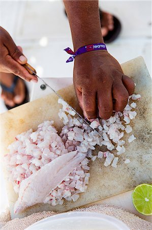 Ceviche being made: fish being diced Fotografie stock - Premium Royalty-Free, Codice: 659-07739465