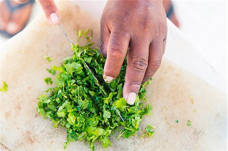Ceviche being made: coriander being chopped Fotografie stock - Premium Royalty-Free, Codice: 659-07739466