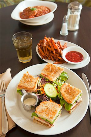 sandwich and chips - Vegan club sandwich with seitan tofu and sweet potato fries Stock Photo - Premium Royalty-Free, Code: 659-07739475