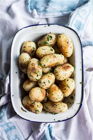 side dishes overhead - New potatoes with herbs Stock Photo - Premium Royalty-Free, Code: 659-07739724