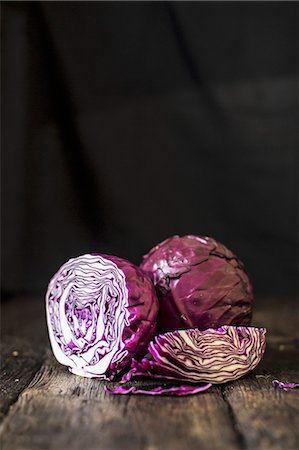red cabbage - Red cabbage, whole and sliced, on a wooden surface Stock Photo - Premium Royalty-Free, Code: 659-07739849
