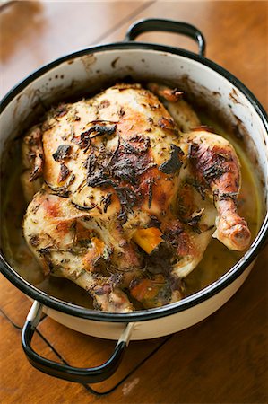 roasted (meat) - Oven roasted chicken with herbs Stock Photo - Premium Royalty-Free, Code: 659-07739890