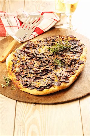 simsearch:659-07739707,k - A sausage and rosemary pizza Stock Photo - Premium Royalty-Free, Code: 659-07739923