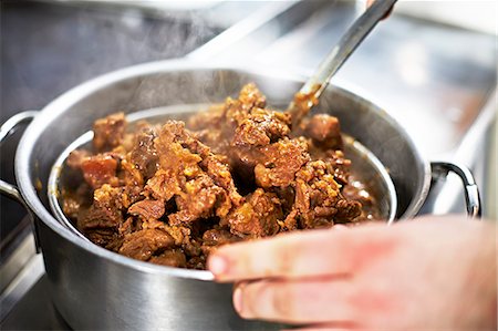 Beef being cooked in a pot Stock Photo - Premium Royalty-Free, Code: 659-07958226