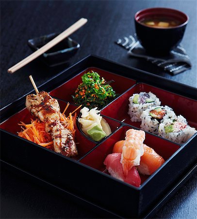 Japanese food in a square varnished box Stock Photo - Premium Royalty-Free, Code: 659-07958380