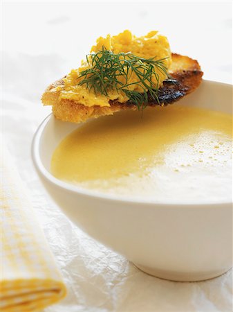 soups on white - Cream of sweetcorn soup with a scrambled egg crostino Stock Photo - Premium Royalty-Free, Code: 659-07958664