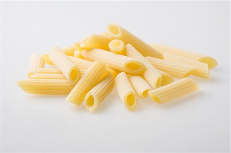 A pile of fresh Penne Rigate pasta Stock Photo - Premium Royalty-Free, Code: 659-07958755