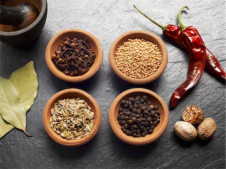 spice still life - Cloves, mustard seeds, fennel, pepper, nutmeg, chilli and bay leaves Stock Photo - Premium Royalty-Free, Code: 659-07958765