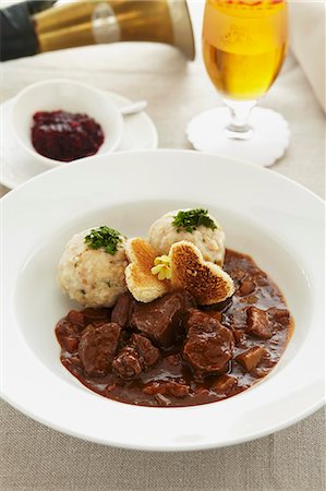 simsearch:659-06307567,k - Young venison ragout with bread dumplings and cranberries Photographie de stock - Premium Libres de Droits, Code: 659-07958811