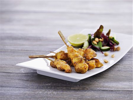satay - Breaded chicken skewers with peanuts Stock Photo - Premium Royalty-Free, Code: 659-07958909
