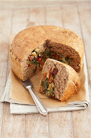 simsearch:659-03527834,k - Wholemeal bread filled with spinach, feta cheese and dried tomatoes Stock Photo - Premium Royalty-Free, Code: 659-07959153