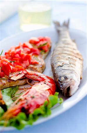 fish food platter with picture - Grigliata Mista fish platter with grilled sea bass, prawns, swordfish and sepia (Italy) Stock Photo - Premium Royalty-Free, Code: 659-07959263