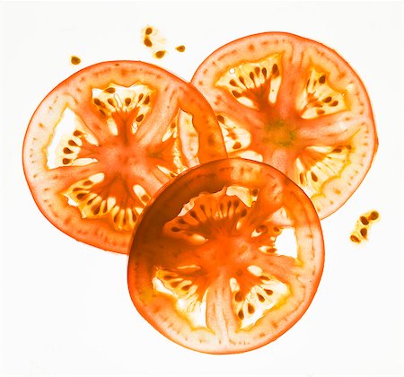 simsearch:659-06902616,k - Back lit tomato slices Photographie de stock - Premium Libres de Droits, Code: 659-07959505