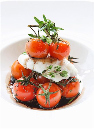 Cod with baked cherry tomatoes in a balsamic sauce Stock Photo - Premium Royalty-Free, Code: 659-07959543