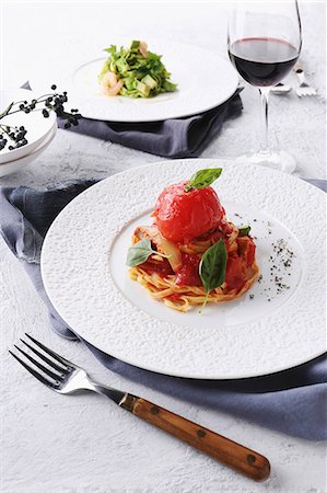 simsearch:659-07610171,k - Pasta with tomatoes and basil served with a glass of red wine Stock Photo - Premium Royalty-Free, Code: 659-07959628