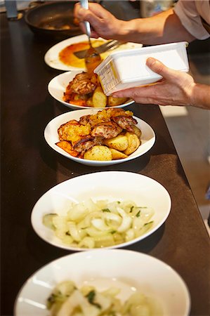 restaurant kitchen - Dishes ready to be served on a counter in a restaurant Stock Photo - Premium Royalty-Free, Code: 659-07959645