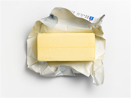 An unwrapped pat of butter on its wrapper Photographie de stock - Premium Libres de Droits, Code: 659-07959714