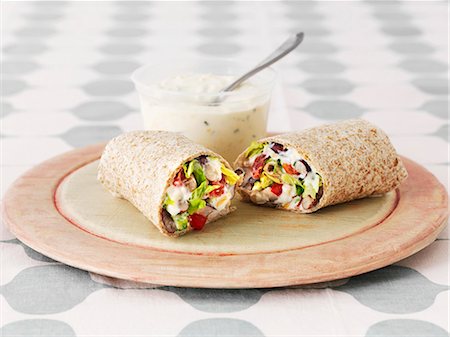 Three bean wraps with sour cream and a chive dip Stock Photo - Premium Royalty-Free, Code: 659-07959829