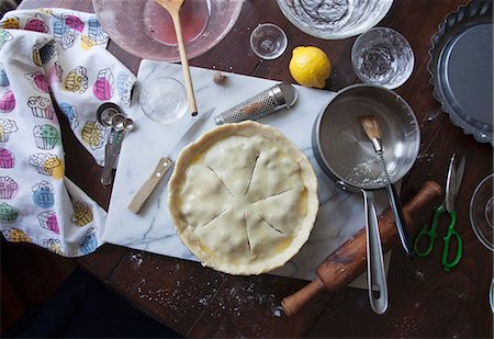 An unbaked blueberry pie, ingredients and baking utensils Stock Photo - Premium Royalty-Free, Code: 659-07959906