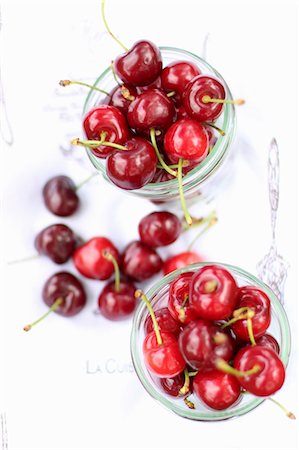 Fresh cherries in glasses and next to them Stock Photo - Premium Royalty-Free, Code: 659-08147014