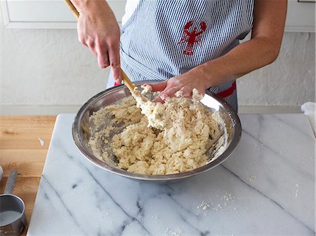 Buttermilk biscuit dough being mixed in a bowl Stock Photo - Premium Royalty-Free, Code: 659-08147031