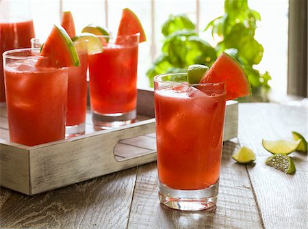 summer refreshment - Watermelon cocktails on a rustic wooden tray Stock Photo - Premium Royalty-Free, Code: 659-08147057