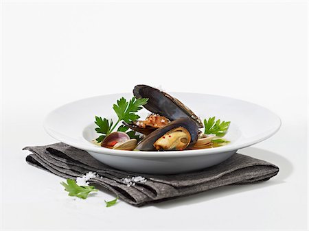 food in the plate - Mussel soup with coriander and coarse sea salt Stock Photo - Premium Royalty-Free, Code: 659-08147094