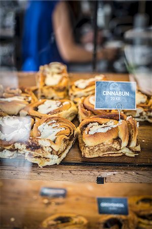 food with pastry - Cinnamon buns at the Torvehallerne market in Copenhagen Stock Photo - Premium Royalty-Free, Code: 659-08147091