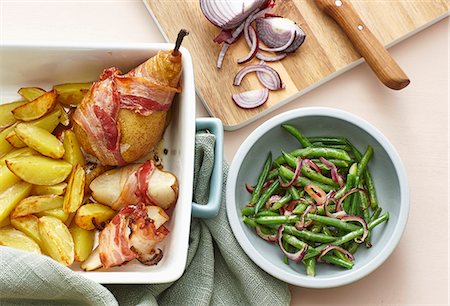 simsearch:659-08897118,k - Bacon-wrapped pears with roast potatoes and a bean and onion salad Stock Photo - Premium Royalty-Free, Code: 659-08147120