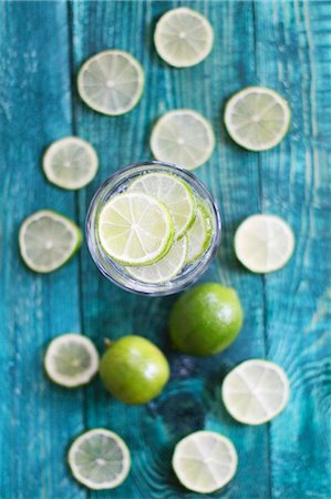 sliced - A glass of water with lots of limes Stock Photo - Premium Royalty-Free, Code: 659-08147162