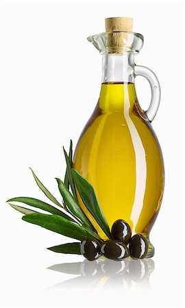 simsearch:659-01842371,k - A carafe of olive oil, a sprig of olive leaves and black olives Stock Photo - Premium Royalty-Free, Code: 659-08147189