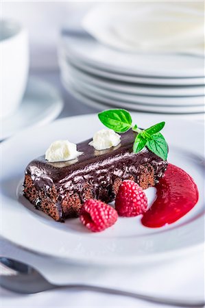 simsearch:659-06372527,k - Chocolate cake with raspberries and raspberry sauce Stock Photo - Premium Royalty-Free, Code: 659-08147350