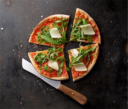 portion - Pizza Margherita with rocket and Parmesan Stock Photo - Premium Royalty-Free, Code: 659-08147623
