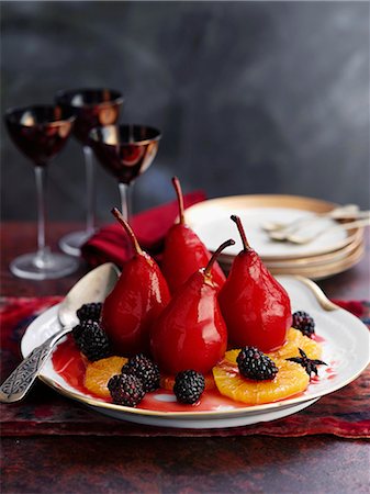 pip fruit - Poached red wine pairs with blackberries and orange slices Stock Photo - Premium Royalty-Free, Code: 659-08147808