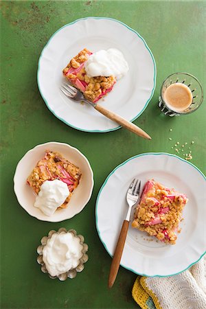 simsearch:659-08940071,k - Three slices of rhubarb crumble cake with cream Stock Photo - Premium Royalty-Free, Code: 659-08148045