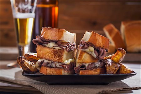 sandwich, nobody - Roast beef and cheese sandwiches with potato wedges and beer Stock Photo - Premium Royalty-Free, Code: 659-08148194