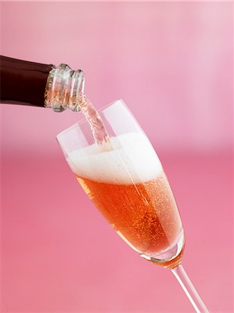 pouring champagne - Pouring a glass of rosé sparkling wine Stock Photo - Premium Royalty-Free, Code: 659-08418676