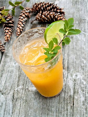 simsearch:659-03524410,k - A glass of orange juice with ice cubes Stock Photo - Premium Royalty-Free, Code: 659-08418741