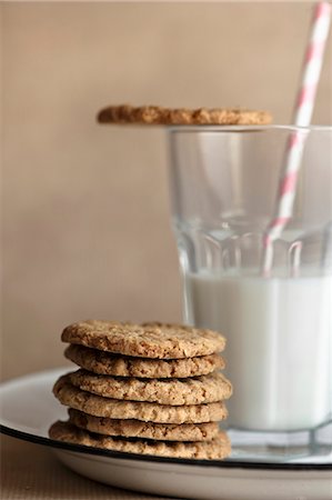 simsearch:659-06153757,k - A stack of biscuits next to glass of milk Stock Photo - Premium Royalty-Free, Code: 659-08418818