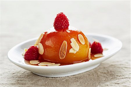 Honey peaches with almonds and raspberries Stock Photo - Premium Royalty-Free, Code: 659-08419214